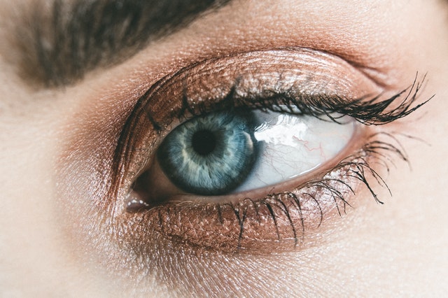 Having pink, red, yellow, blue, or spotty sclerae could be a sign of an underlying condition. Photo by Lisa on Pexels.