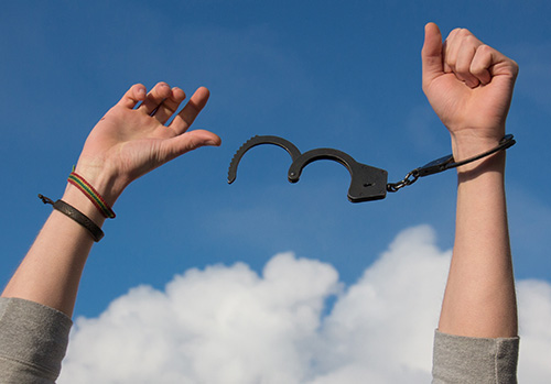 Financial responsibility breaking people free from the handcuffs of debt.