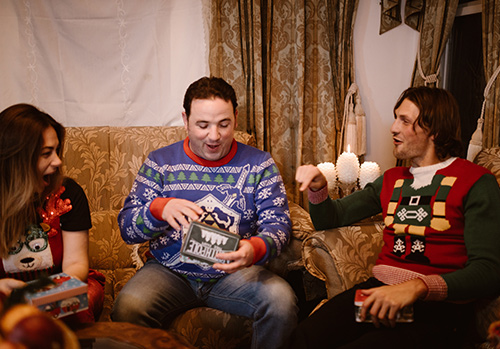 A group of family members exchanging gifts on Christmas.