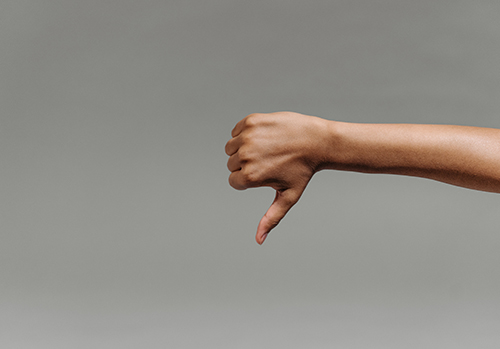 A hand doing the thumbs down symbol.