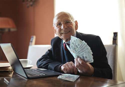 A man smiling and very happy after working with a company about life settlements.