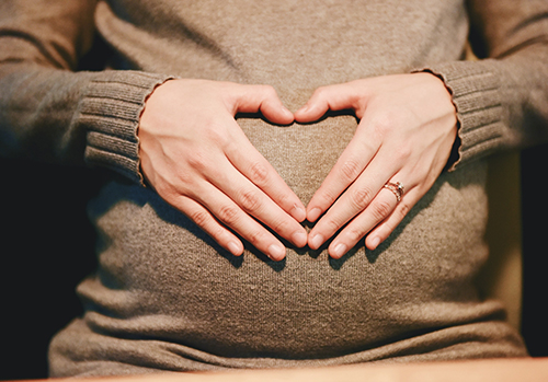 pregnant-woman-with-hands-on-belly