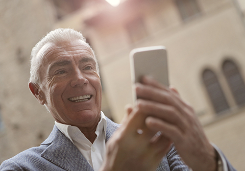 Older man on cell phone.