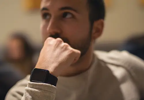 Man wears an Apple Watch.